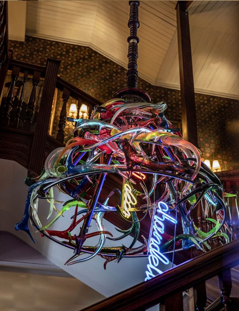 Red deer chandelier by Richard Jackson, hung in the hotel lobby.
