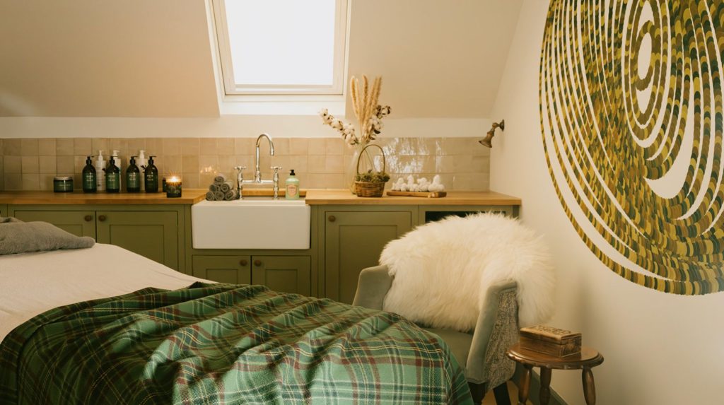 A treatment table and chair in the Albamhor Treatment Rooms.