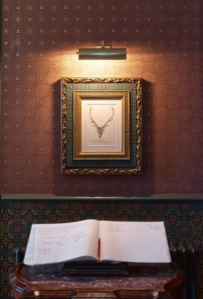 A framed drawing of a stag by Queen Victoria hanging in the lobby of the Fife Arms.