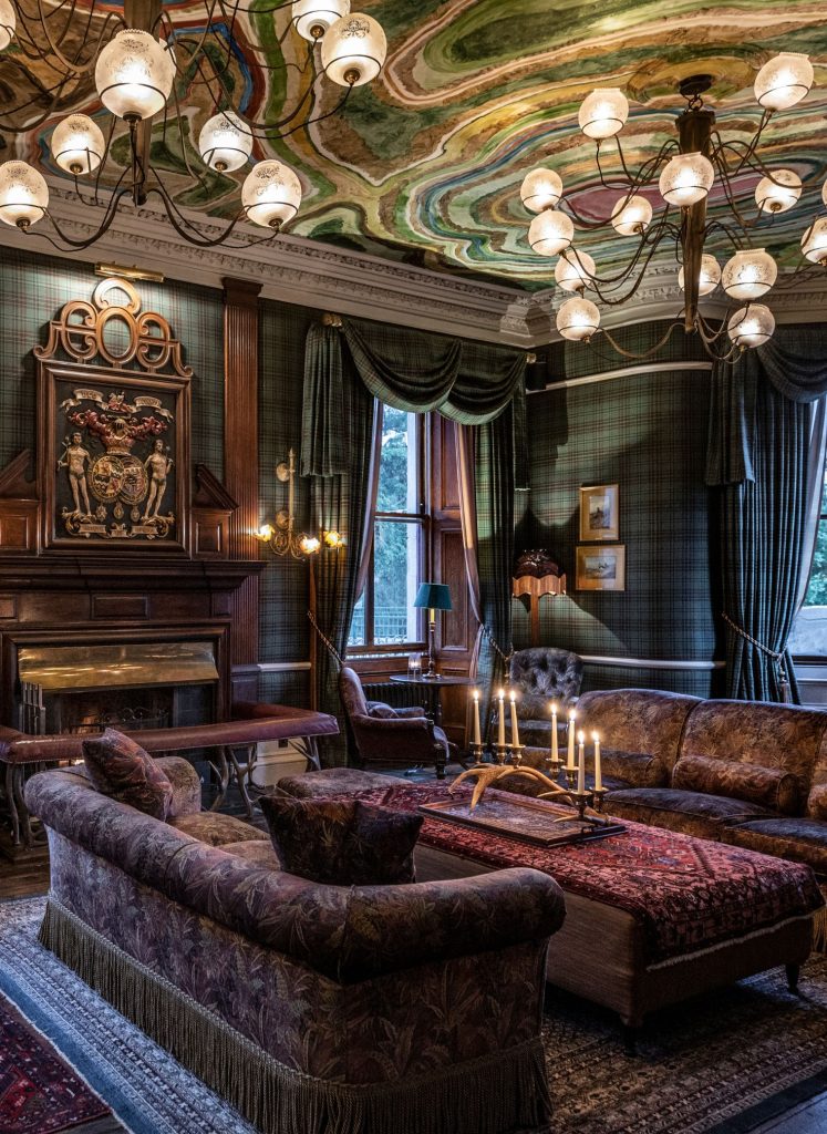 The drawing room at the Fife Arms with a dramatic painted ceiling