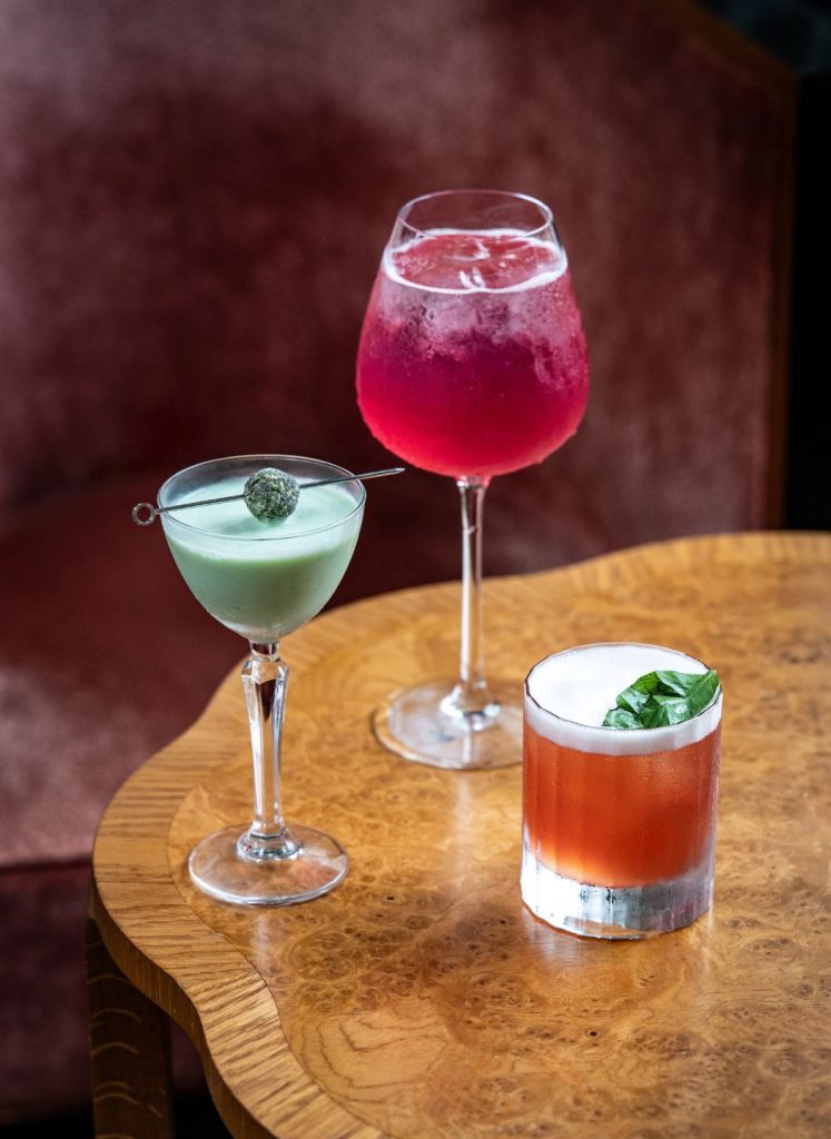 Three cocktails on a table in Elsa's Cocktaiil Bar