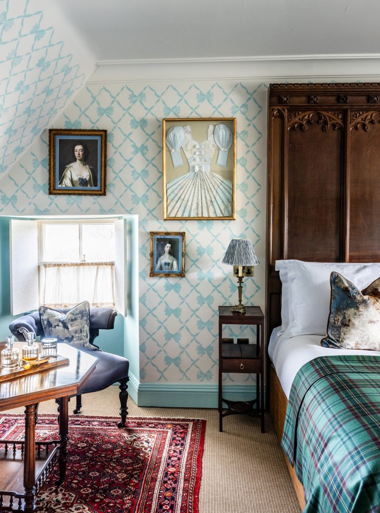 The bed and artworks in the Flora MacDonald room