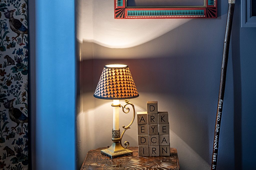 A lampshade on a table in the Nan Shepherd room