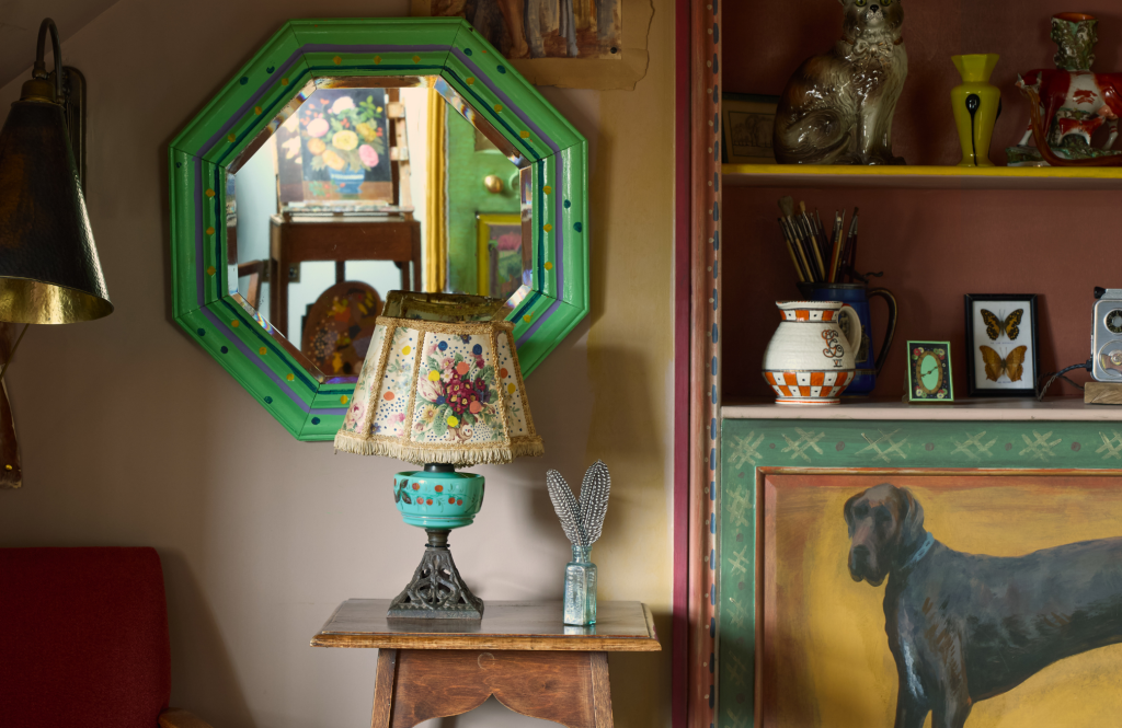 Mirror, lampshade and bookshelves in the Artist's Studio.