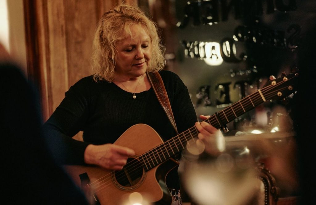 A guitarist performing in the Flying Stag