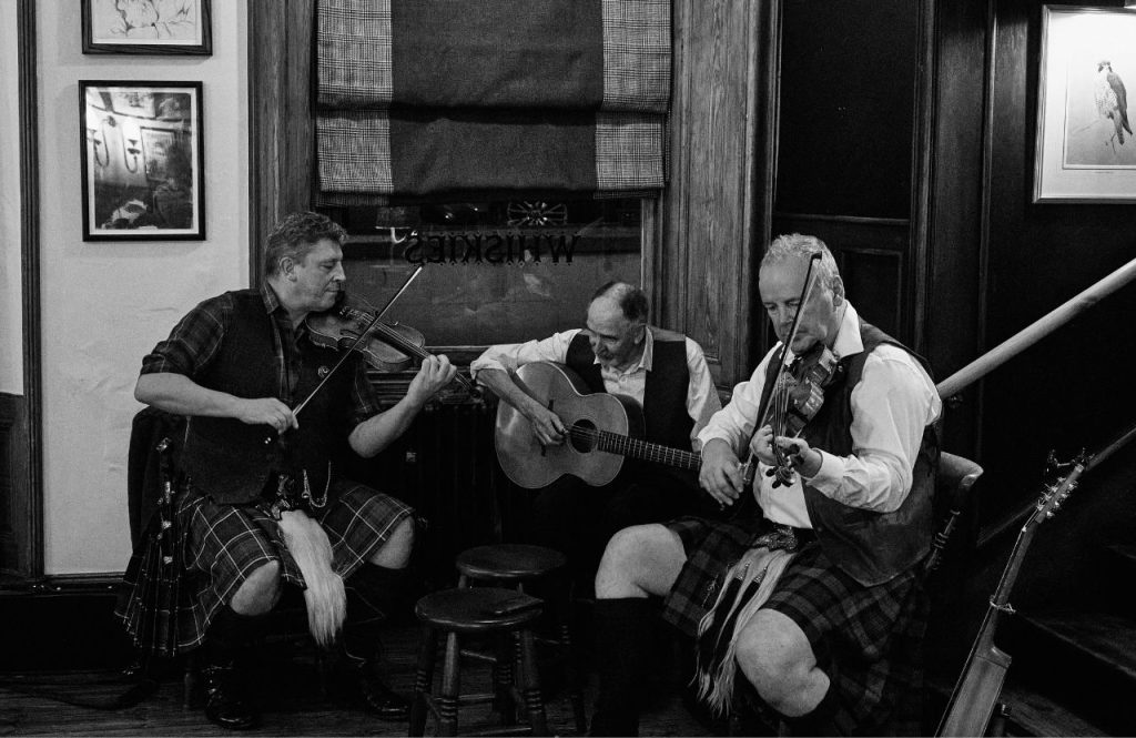 Folk musicians performing in the Flying Stag