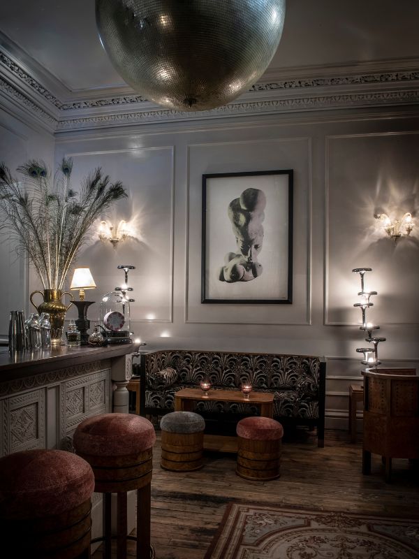 Hans Belmer print hung in Elsa's Cocktail Bar