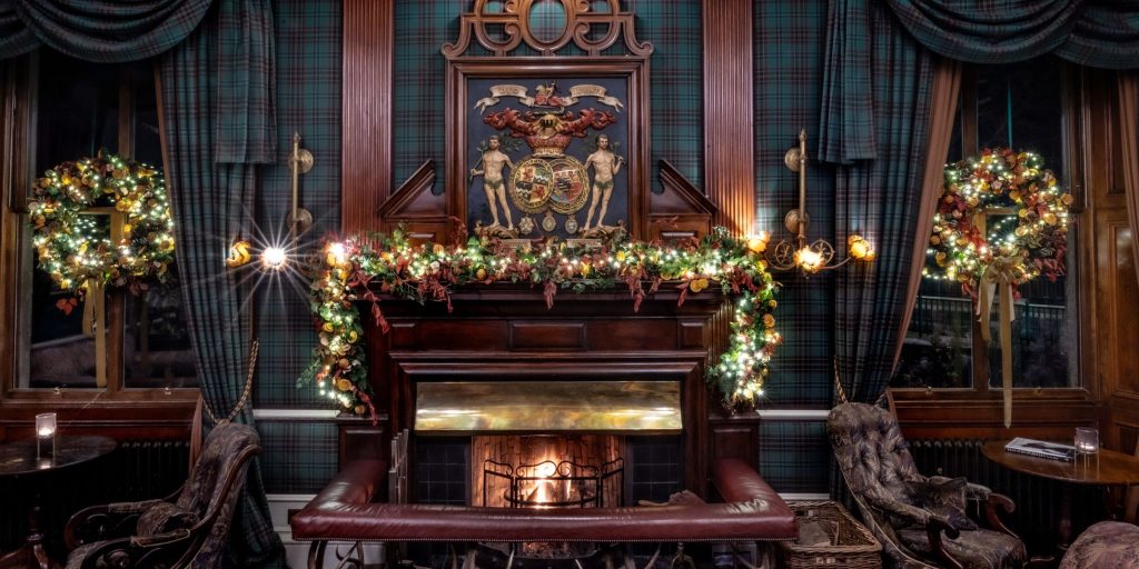 Christmas decorations over the fireplace in the Fife Arms drawing room