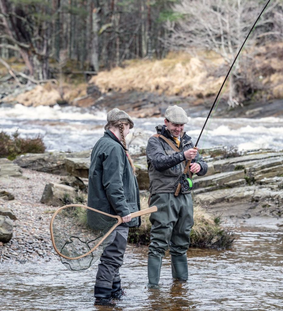 A couple fishing along the River Dee
