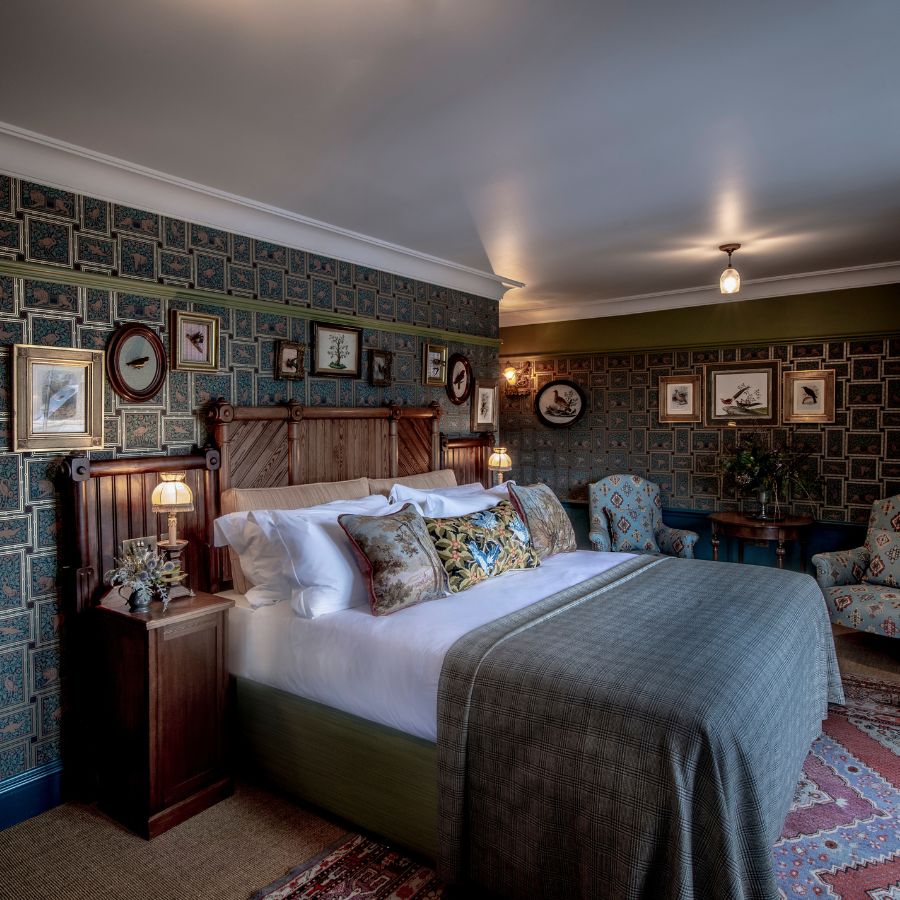 The Fife Arms Zoology room, with patterned wallpaper and a double bed